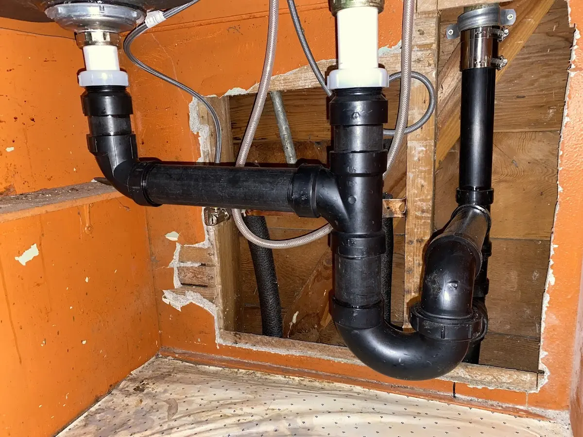 Professional Garbage Disposal Repair equipment and tools on the job in Halifax